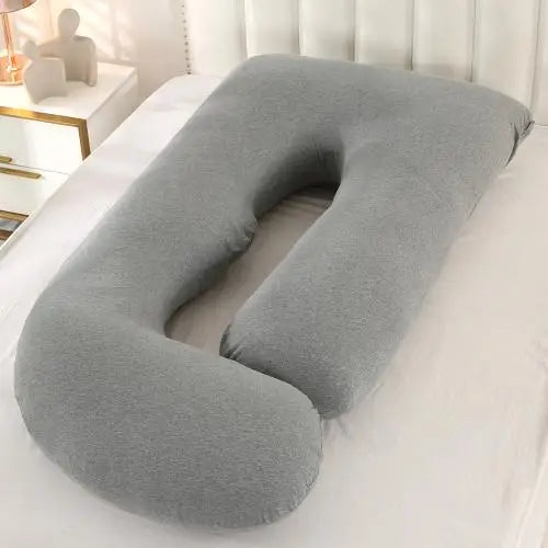 Grey J-shaped pregnancy pillow.