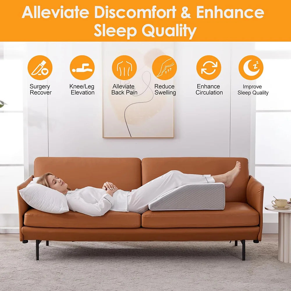 Person using a wedge inclined acid reflux pillow on a couch to alleviate discomfort and enhance sleep.