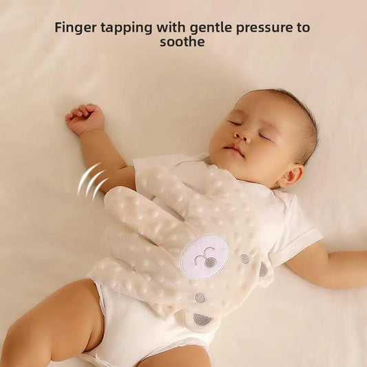 Electric hand-clapper gently taps on baby with gentle pressure to soothe baby to sleep.