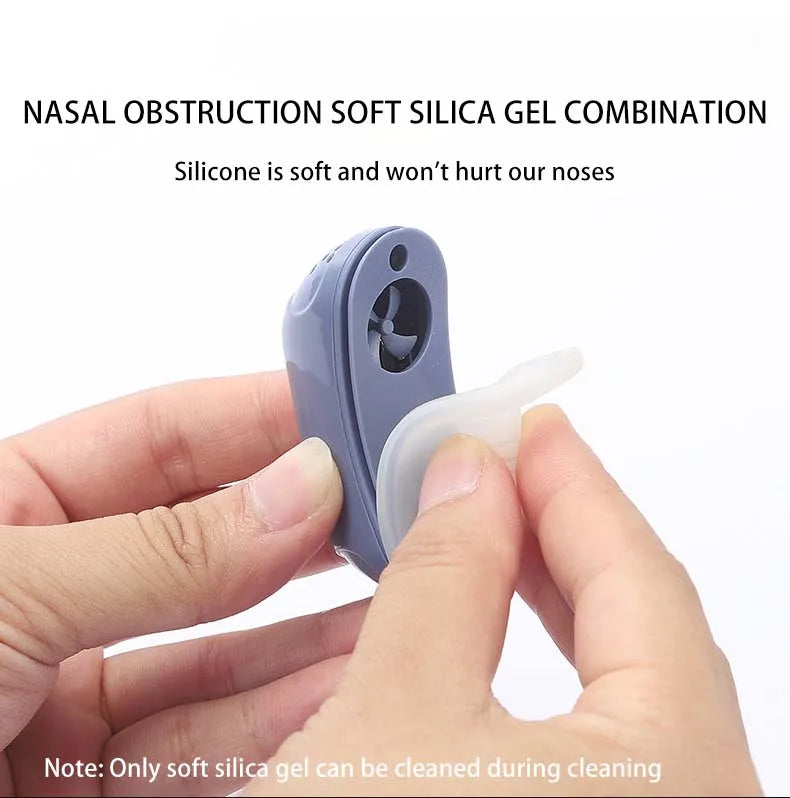 Hand holding a nasal soft silica gel that can be detached from the anti snoring device.