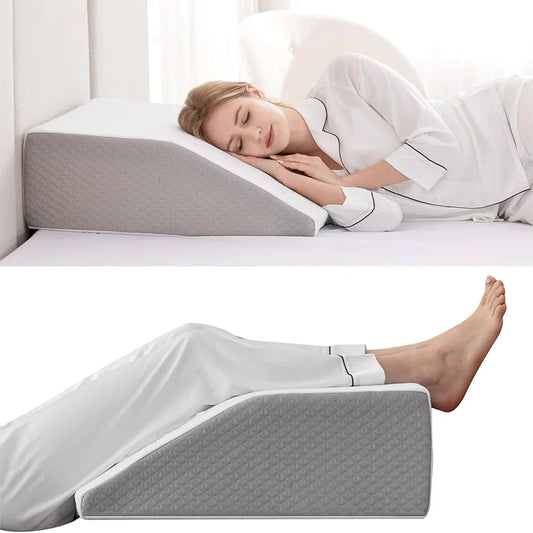 Woman lying on a bed with wedge inclined acid reflux pillow for support