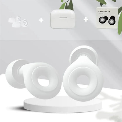 White wireless earbuds with packaging on a light gray background