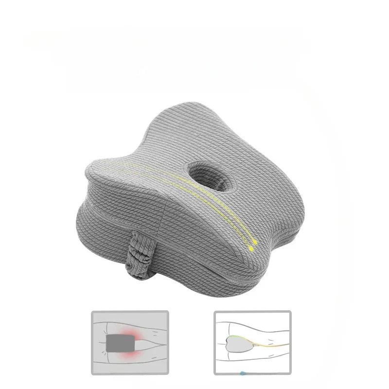 Memory foam leg pillow with strap for sleep use. Light grey.