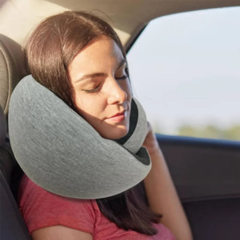 Lady sleeping in a car using the Travel pillow U-shaped.