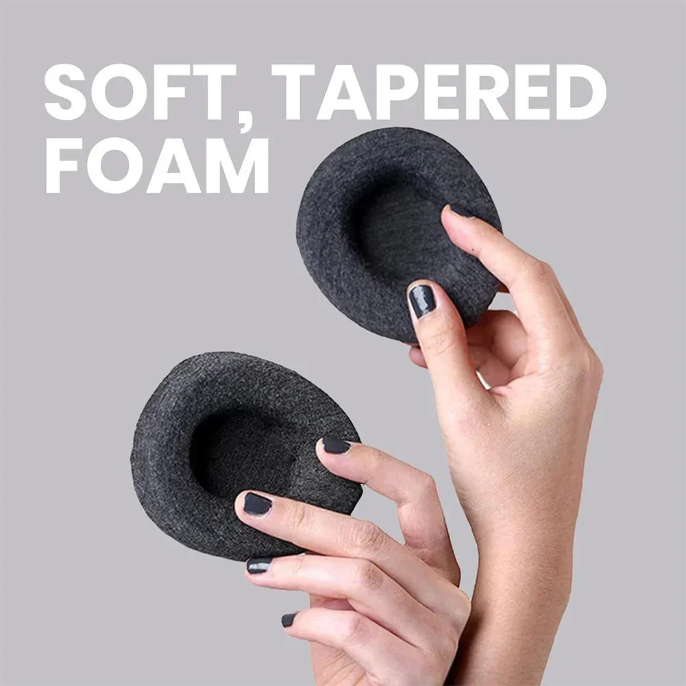 Two black soft, tapered foam products held by a hand against a gray background with text 'SOFT, TAPERED FOAM'.