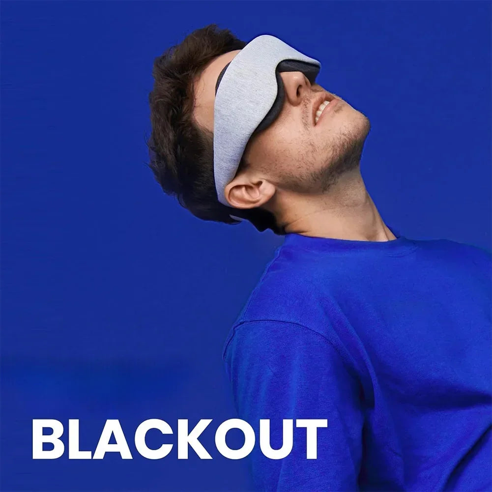Person wearing a gray sleep mask against a blue background with 'BLACKOUT' text.
