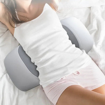Person using a lumbar support pillow while sleeping.
