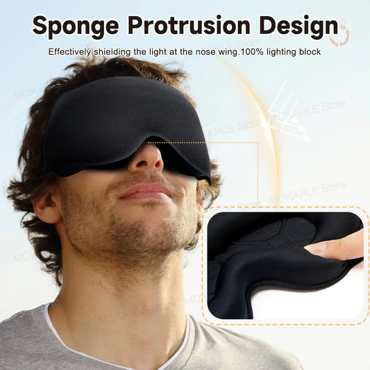 Man wearing a black sleeping eye mask with comfortable nose support. 