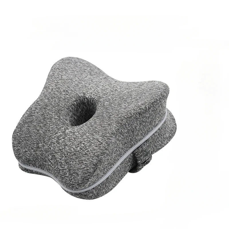 Dark grey leg pillow. 