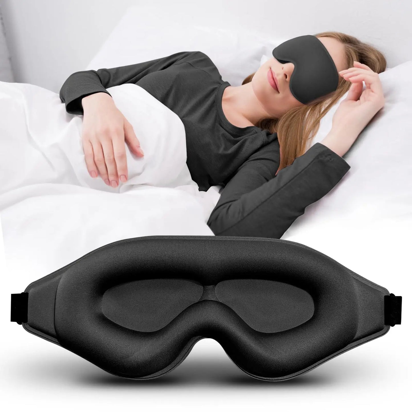 Person lying in bed wearing a black sleep mask with another black sleep mask in the foreground.