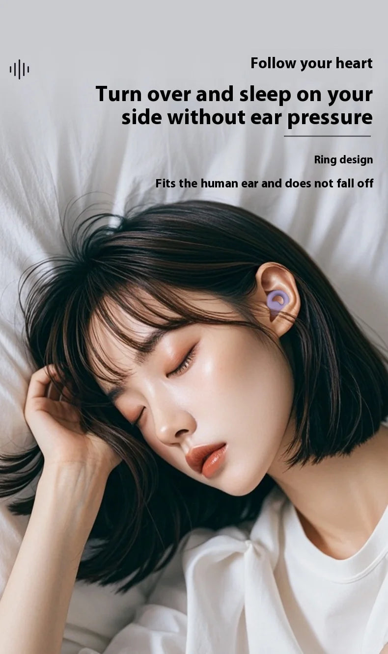 Person sleeping sideways with a soft pink noise reduction ear bud without any ear pressure.