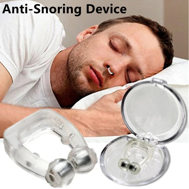 Magnetic anti-snoring sleep apnea  device being used by a man sleeping.