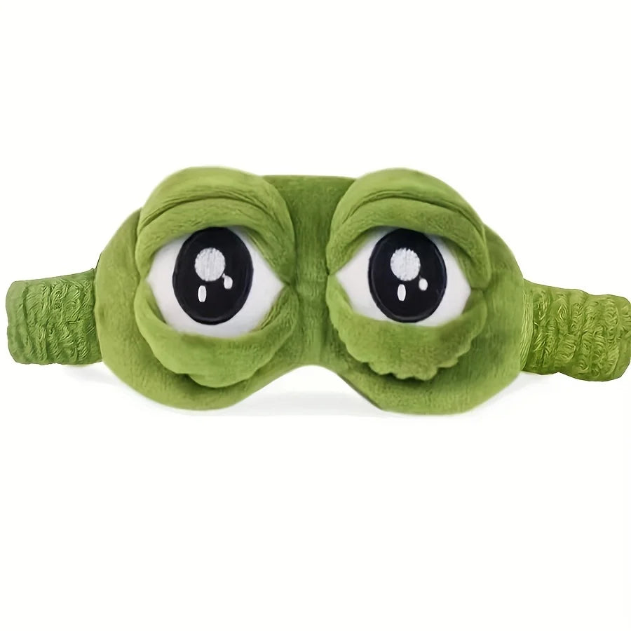 Green plush eye mask with eyes open.