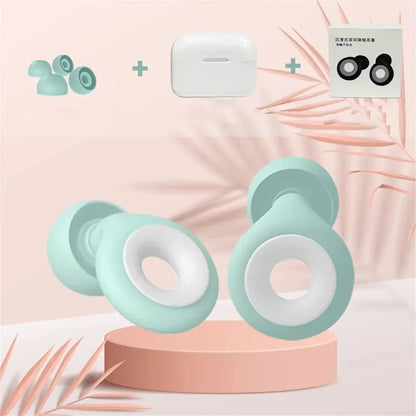 Light blue and white dumbbell-shaped products on a pink platform with palm leaves.