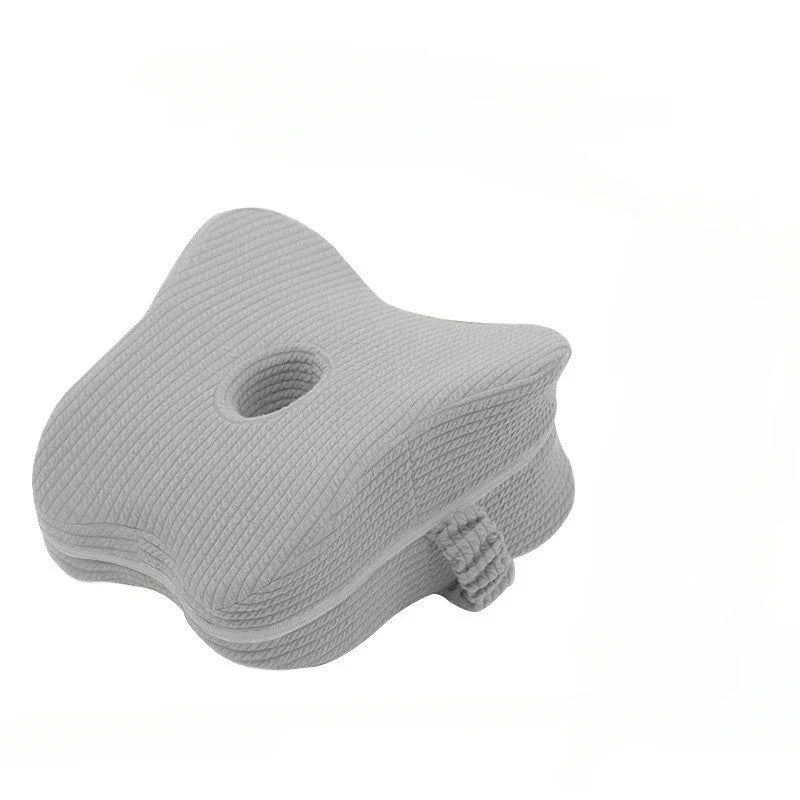 Light grey leg pillow.