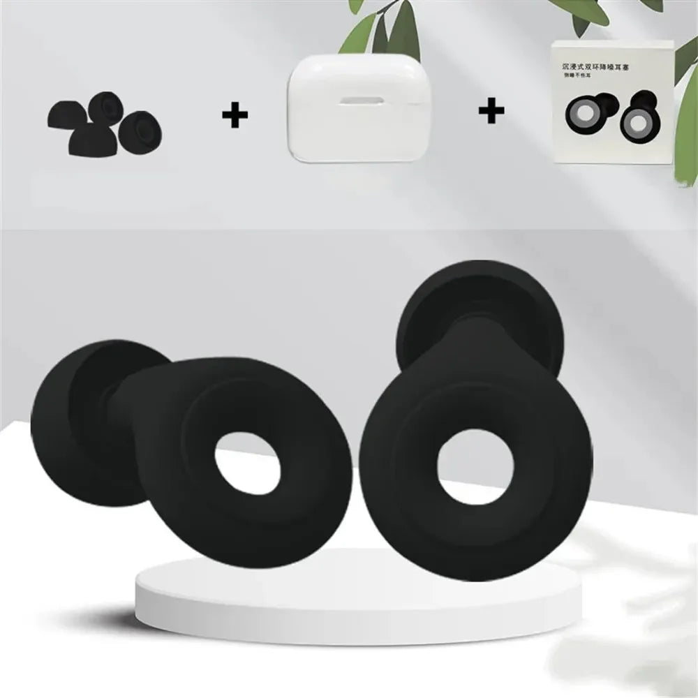 Black silicone donut-shaped products on a white stand with a neutral background