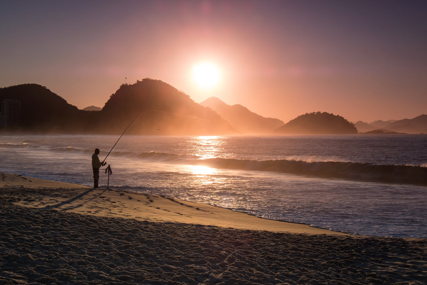 Sleepwellness founder Shawn fishing in the ocean.