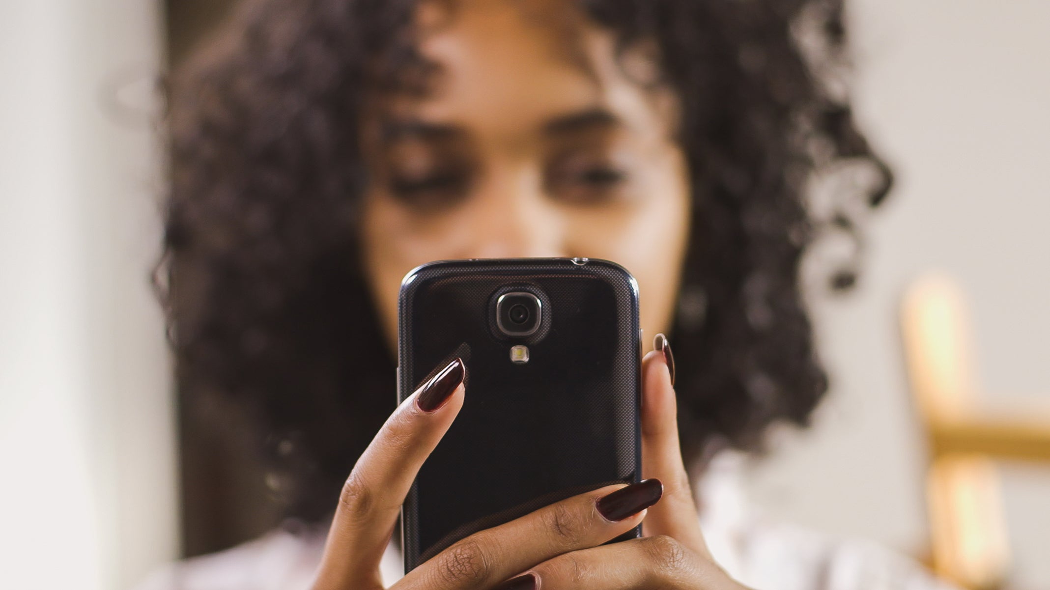 Woman using mobile phone.